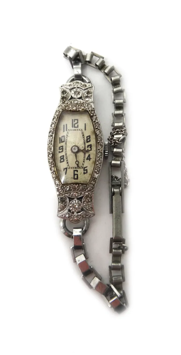 A lady's 18ct white gold, diamond and colourless gem set dress wristwatch, the shaped oval dial with black Arabic numerals, the case surround mounted