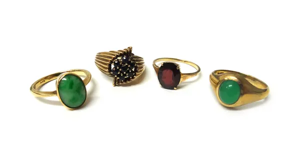 A 9ct gold and sapphire set seven stone cluster ring with fluted shoulders, a gold ring mounted with an oval jade, detailed 9ct, a 9ct gold and caboch