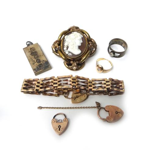 A 9ct gold bar and oval link gate bracelet with a 9ct gold heart shaped padlock clasp, two further gold heart shaped padlock clasps, a gold and diamon