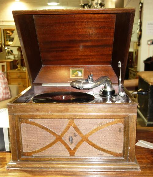 A single dark blue lined curtain, with a gold motif, 80cm wide x 290cm long, with a pelmet, (2).