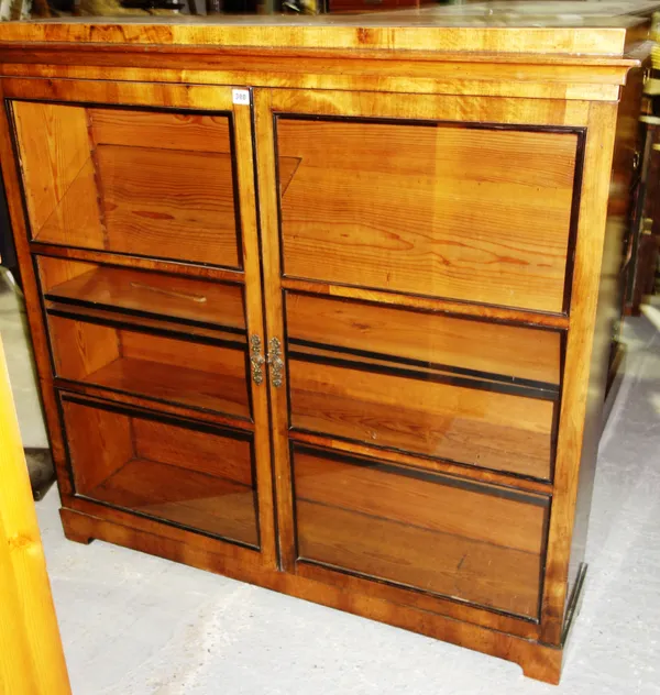 A 20th century teak side unit with pair of glazed doors and and arrangement of cupboards, 119cm wide. E6