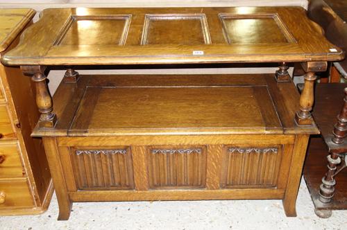 An early 20th century multi tier oak and brass Canterbury, 48cm high.    C4