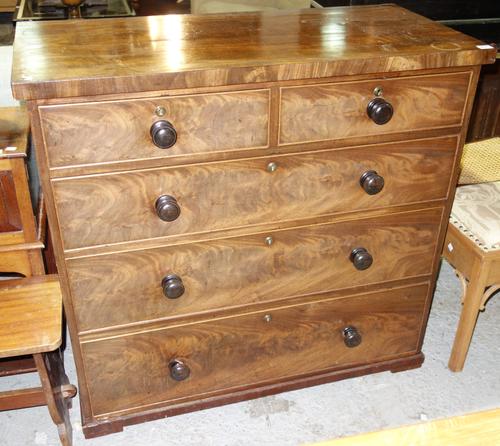 A 20th century walnut desk, with green leather inset top, 141cm wide.  C1