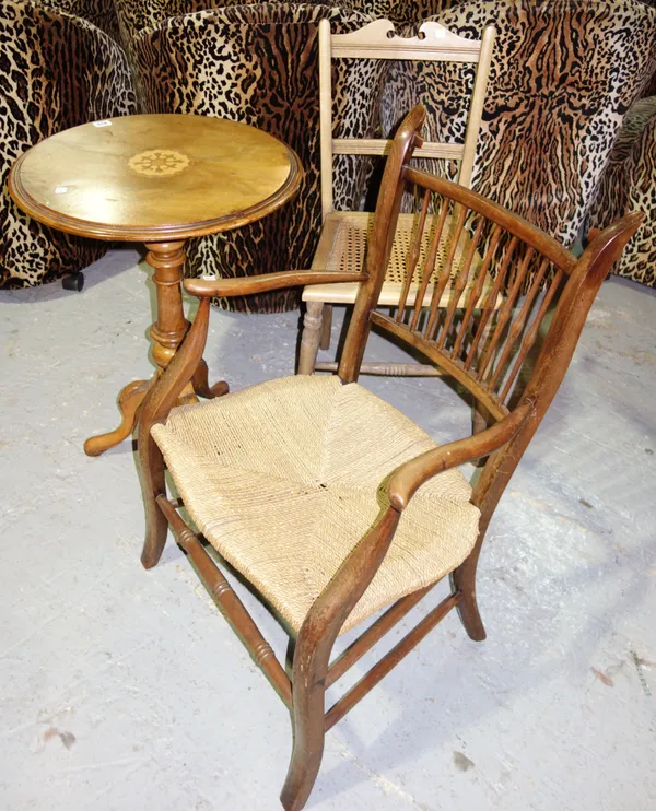 A late 19th/early 20th century elm and beech high barrel/stick back open armchair, on turned supports. L8