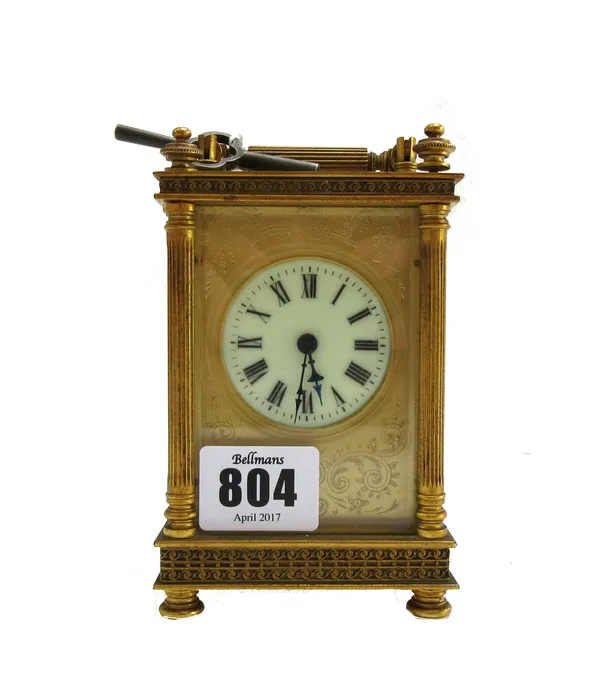 A French brass cased carriage clock, circa 1900, with hour push repeat and visible platform escapement, the dial plate with applied pierced wild birds