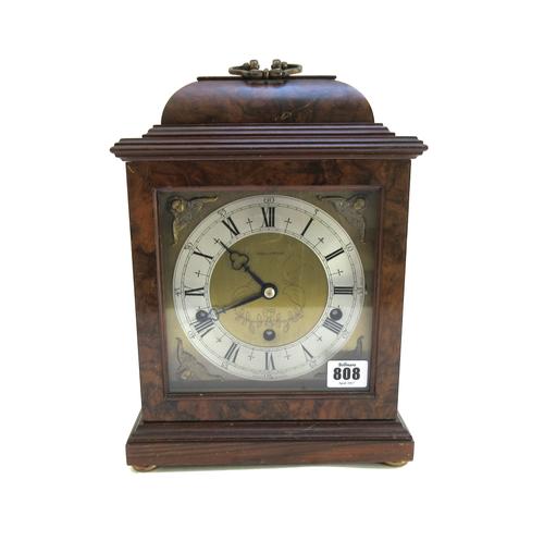 A French Louis XVI style white marble and ormolu mounted timepiece, late 19th century, with foliate loop handle and matching embellishments to the squ