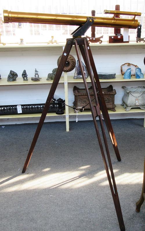 An early 20th century mahogany cased plate camera, with applied plaque detailed 'Surrey Athletic Supply', with further cased lenses and canvas bag.