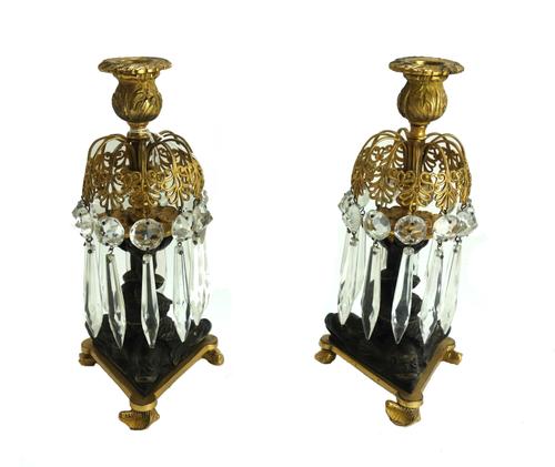 A pair of modern octagonal wooden table lamps, each gilt foliate decorated against a rouge baluster ground, (a.f),53cm high, (2).