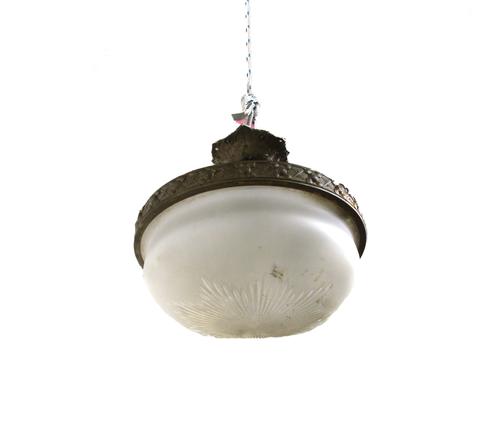 A pair of Victorian Gothic revival brass altar candlesticks, late 19th century, each cast monogram  with opposing mirror on a circular base and three