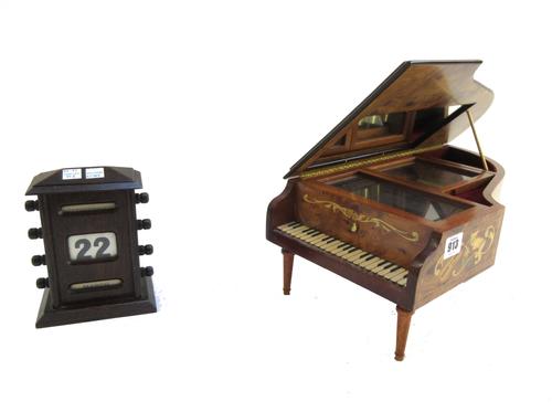 A gilt lacquered bronze chandelier in the manner of Louis Comfort, Tiffany, early 20th century, with Gothic dragon cast stem over a hexagonal bowl iss