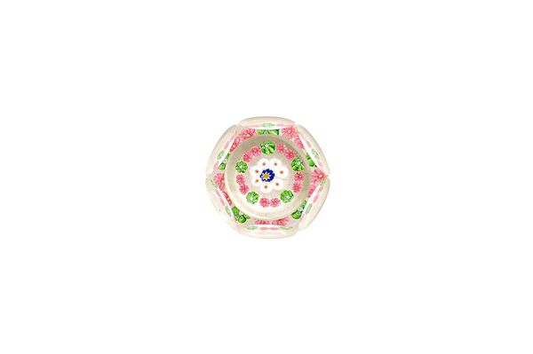 A Clichy faceted concentric millefiori paperweight, mid-19th century, set with a central blue and white cogwheel cane inside concentric white canes an