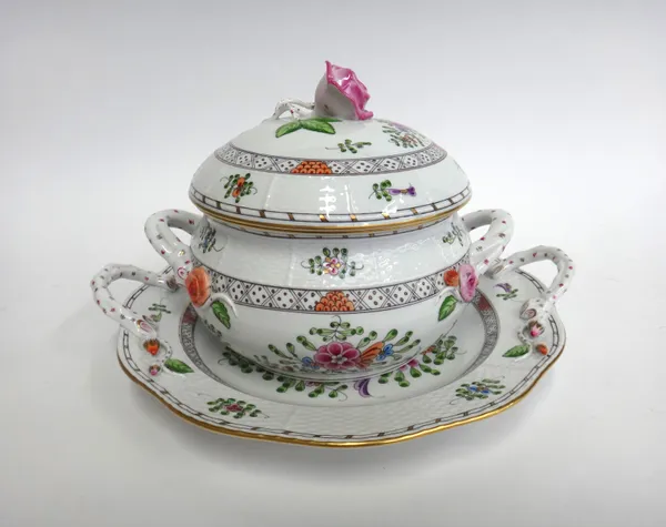 A Herend porcelain tureen, cover and stand, with rose finial over a two handled circular body and stand, foliate decoration with a relief moulded bask