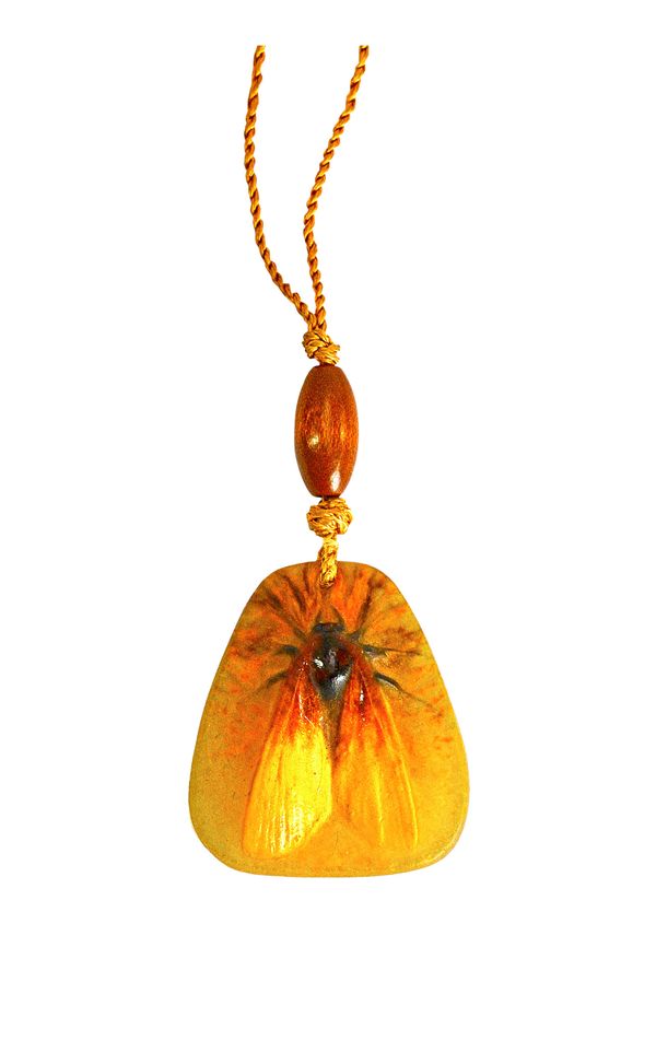 An Almaric Walter pate-de-verre pendant, circa 1925, of rounded triangular form, moulded with a moth in shades of yellow, brown and ochre, moulded sig