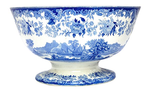 A massive Davenport blue and white printed earthenware punch bowl, mid-19th century, printed on the interior and exterior with a river landscape with