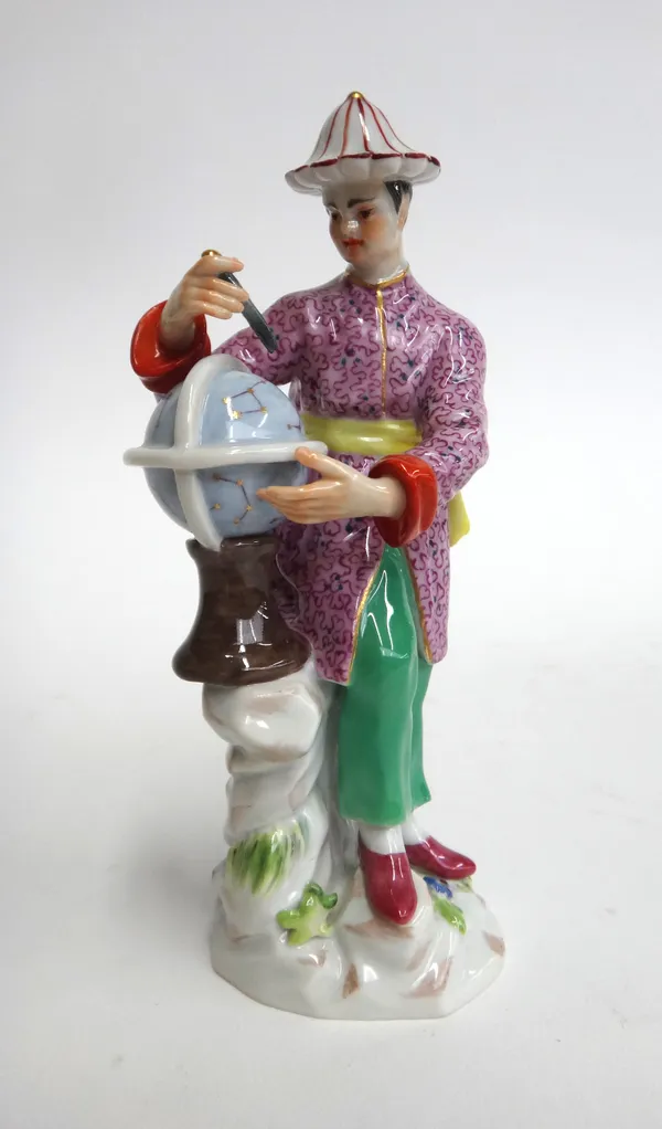 A Meissen porcelain figure, 20th century, modelled as a Mandarin attending a globe, raised on a naturalistic base, blue crossed swords mark, incised '