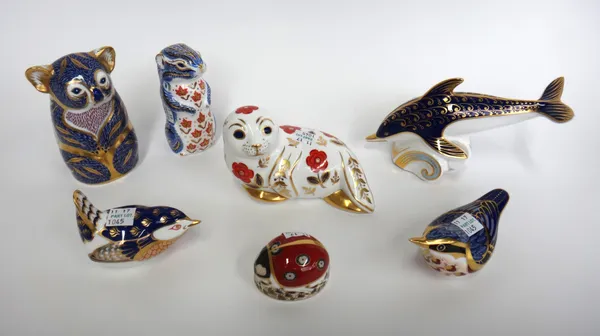 Seven Royal Crown Derby animal paperweights, each decorated in a gilt Imari pattern, comprising; a dolphin, a ladybird, a koala, two birds, a seal and