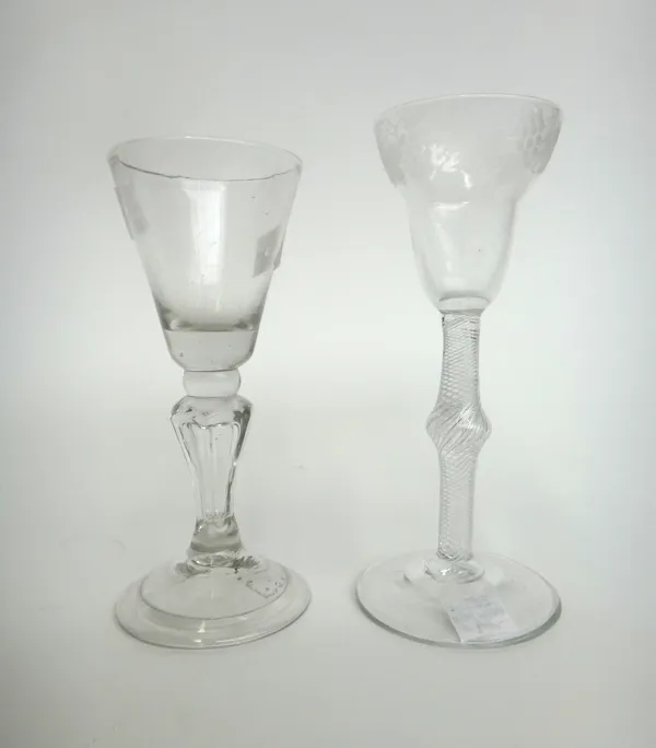 An engraved wine glass, circa 1750, the pan topped bowl engraved with fruiting vine, raised on a multi series airtwist stem with central knop, plain f