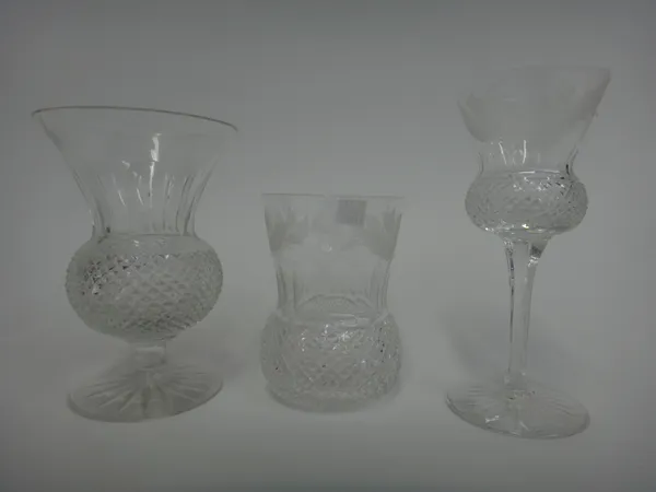 An Edinburgh part suite of stemware, 'Thistle' pattern, comprising; two decanters and stoppers, one smaller, five white wine glasses, five red wine gl