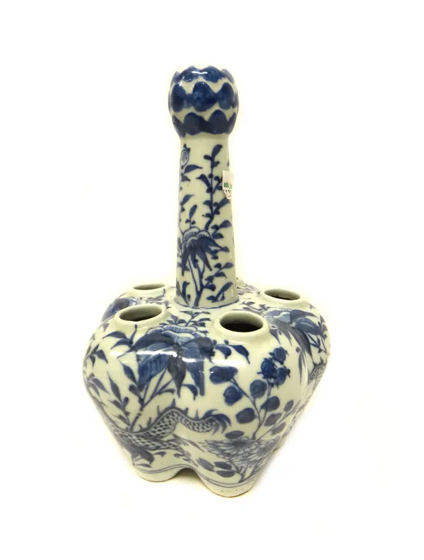 A Chinese blue and white crocus vase, late 19th century, painted with two dragons amongst flowers, 24.5cm. high.