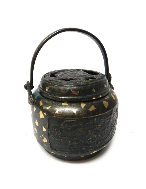 A Japanese patinated bronze and gold flecked koro and cover, Meiji period, the cylindrical sides cast in relief with two landscape panels, the cover p