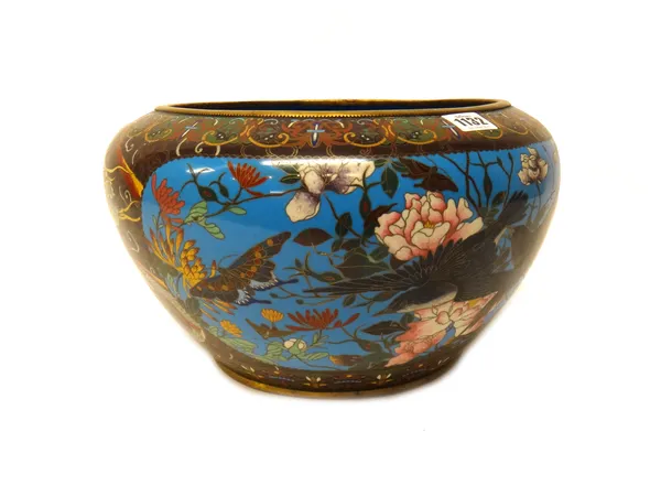 A Japanese cloisonné jardiniere, Meiji period, worked with two blue-ground panels enclosing birds in flight amongst flowers, against a brown ground de