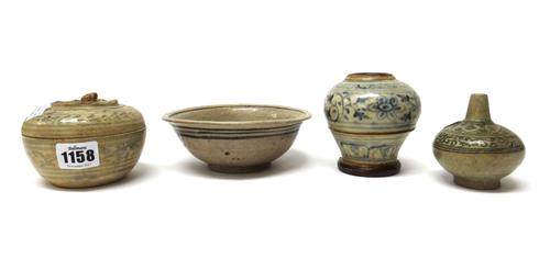 A group of South East Asian pottery, comprisng; a Thai circular box and cover, Sawankhalok, 15th/16th century, 10.25cm. diameter; a small Thai bottle