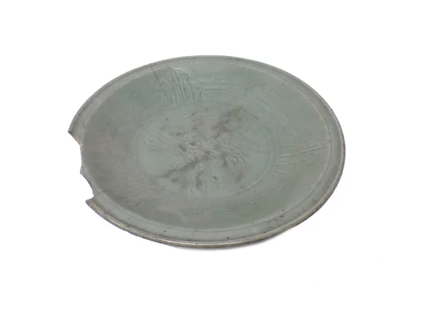 A large Chinese celadon dish, Ming dynasty, decorated with a central phoenix, (a.f), 42cm.diameter.