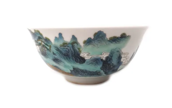 A Chinese famille-rose bowl, painted on the exterior with an extensive landcape, blue Qianlong seal mark, 15cm. diameter.