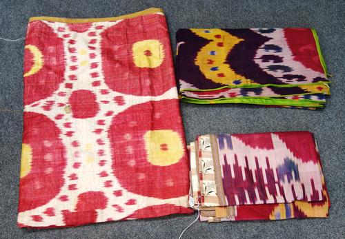 Seven Ikat panels, Uzbekistan, late 19th/early 20th century, of square and rectangular form, mostly on cream and burgundy ground, with typical motifs,