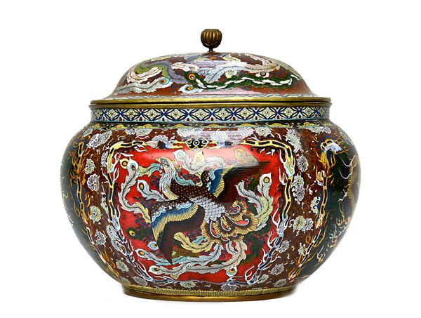 A large Japanese cloisonné vase and cover, Meiji period, of lobed oval form, worked in copper wire and colourful enamels, worked with panels enclosing