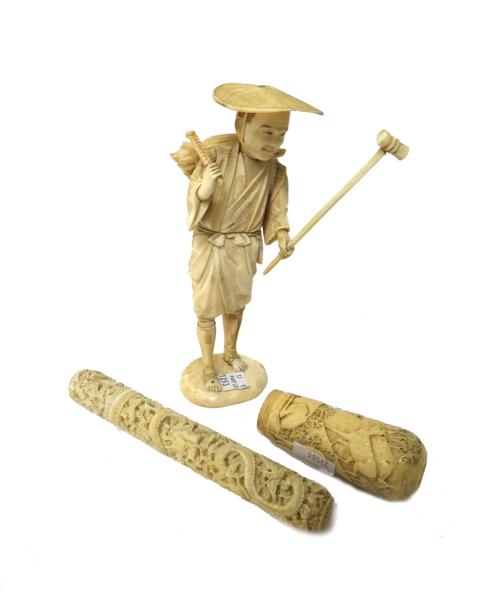 A group of ivory carvings, late 19th/early 20th century, comprising; a Canton ivory cylindrical  bodkin case carved with dragons amidst cloud scrolls