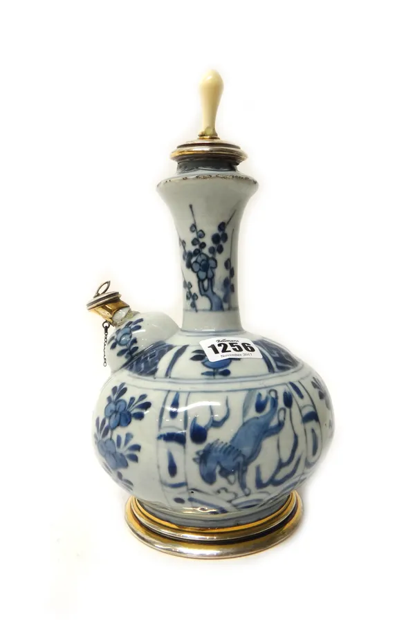 A Chinese blue and white porcelain kendi, Wanli, painted with flower and horse panels, later French silver-gilt  mounts and ivory finial, overall heig