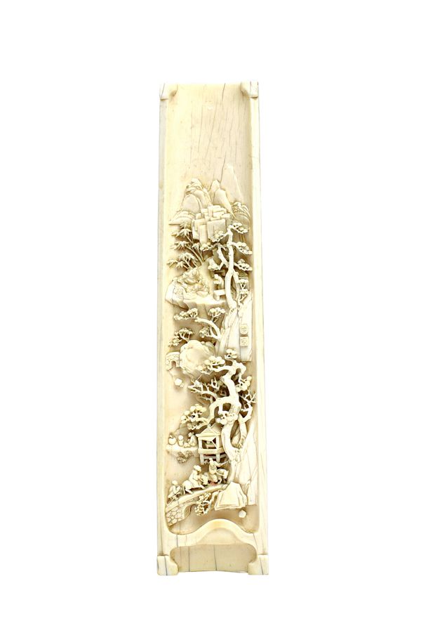 A Chinese ivory wrist rest, late 19th/early 20th century, the interior carved and pierced with figures in a mountainous landscape, with two carved sea