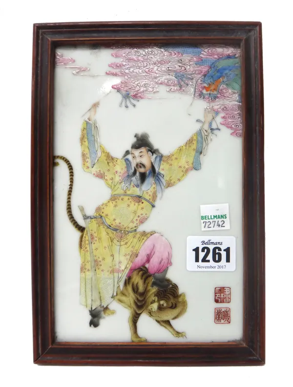 A Chinese famille-rose plaque, 20th century, painted with a figure with a tiger beneath a dragon amongst clouds, 19cm. by 12cm., framed.