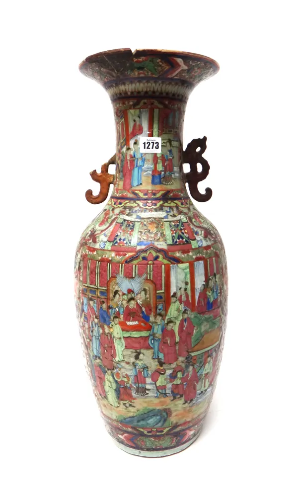 A large Canton famille-rose two-handled baluster vase, 19th century, painted with figurative panels against a green ground filled with dragons, flower