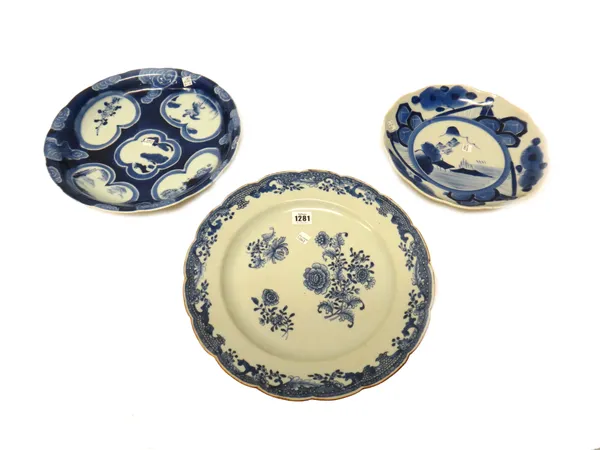 A large Chinese export blue and white plate, Qianlong, painted with scattered flower sprays inside an elaborate border, 35.5cm. diameter; also two Jap