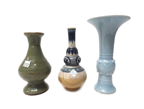 A Chinese porcelain vase, six character Kangxi mark but later, of gu form covered in a lavender glaze, 20.25cm., 8in.high; also a pear shaped celadon