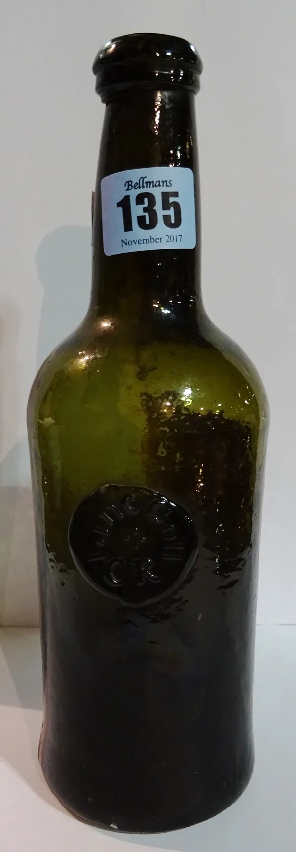 An 18th century green glass small wine bottle. CAB