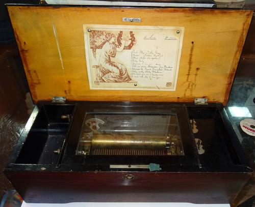 A 19th century faux rosewood Swiss music box, 10 airs.  CAB