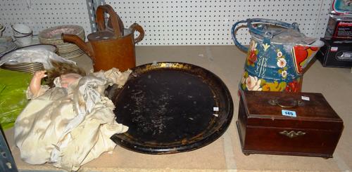 Collectables, including; a 19th century oval black and gilt papier mâché tray, a small wooden box, two metal watering cans on painted brightly the oth