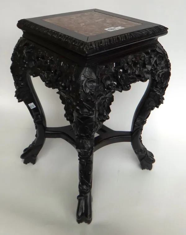 A late 19th century Chinese jardiniere stand, the marble inset square top on a pierced and carved hardwood base, 34cm wide x 48cm high.
