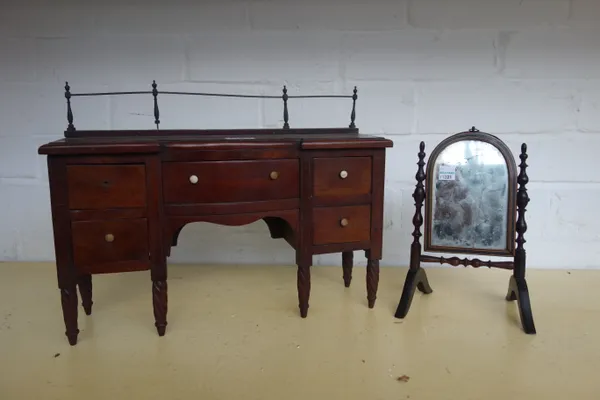 A 19th century diminutive mahogany sideboard, with metal galleried back over five frieze drawers, on spiral fluted supports, 37cm wide x 26cm high x 1