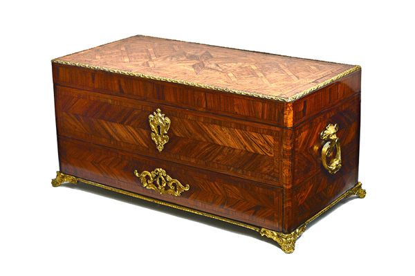 A Napoleon III gilt metal mounted feather banded Kingwood jewellery box, the rectangular top enclosing a silk lined tray interior over one long drawer