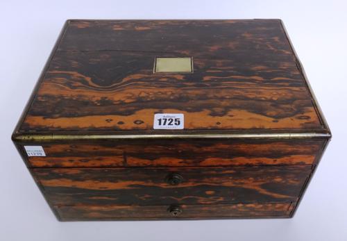 A Victorian brass mounted coromandel toilet box, the rectangular lift top enclosing a fitted interior over single drawer, both fitted with Bramah lock