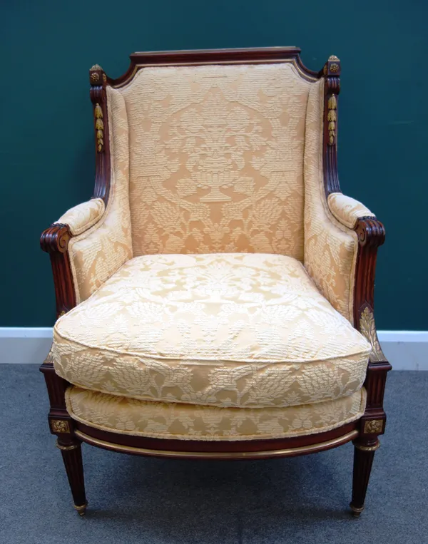 A Louis XVI style ormolu mounted mahogany armchair, with downswept arms and bow seat, on tapering fluted supports, 72cm wide x 102cm high x 57cm deep.