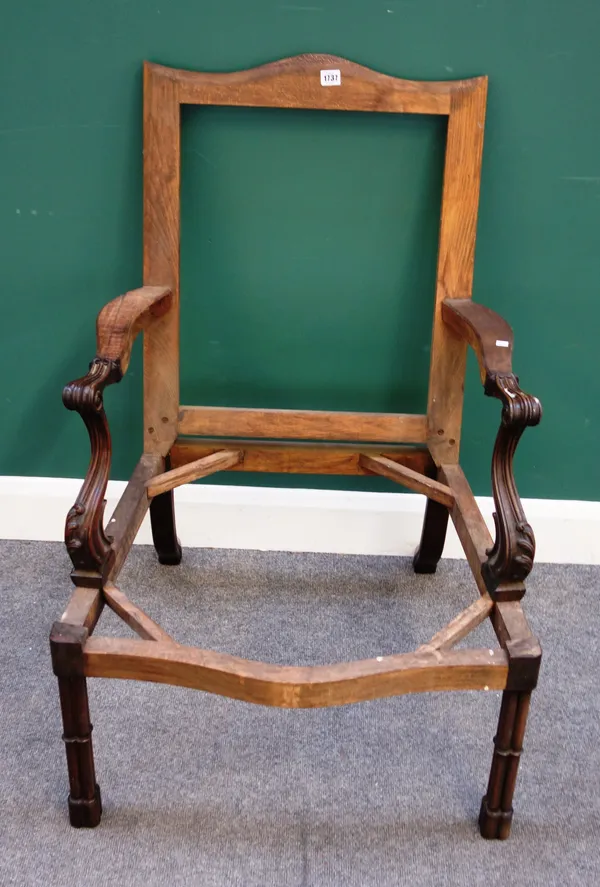 A mid-18th century style Gainsborough armchair frame, with hump back, carved open arms and serpentine seat, on cluster column supports, 67cm wide x 10