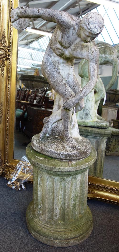 After the Antique, a reconstituted stone figure group of a discus thrower, on a fluted circular pedestal, 150cm high.