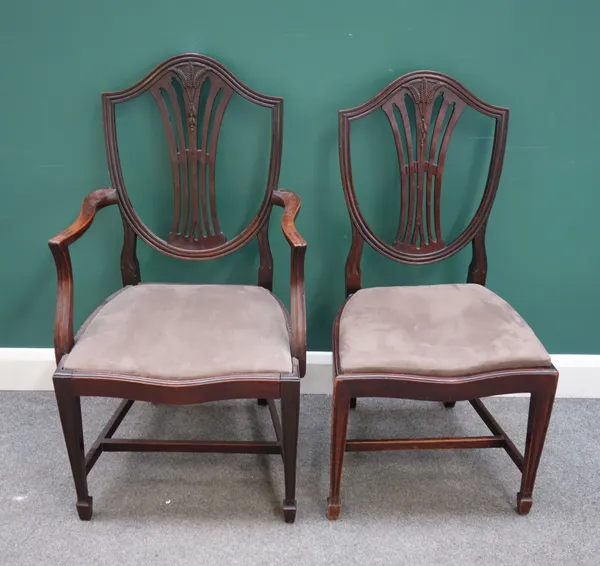 A set of eight George III style mahogany framed shield back dining chairs, each with serpentine seat and tapering square supports, to include a pair o