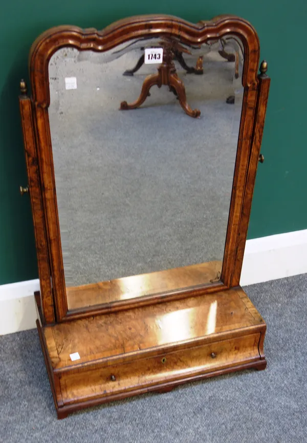 'T. Wilson, 68 Great Queen Street, London'; an 18th century walnut toilet mirror, with shaped bevelled mirror plate over single cushion frieze drawer,