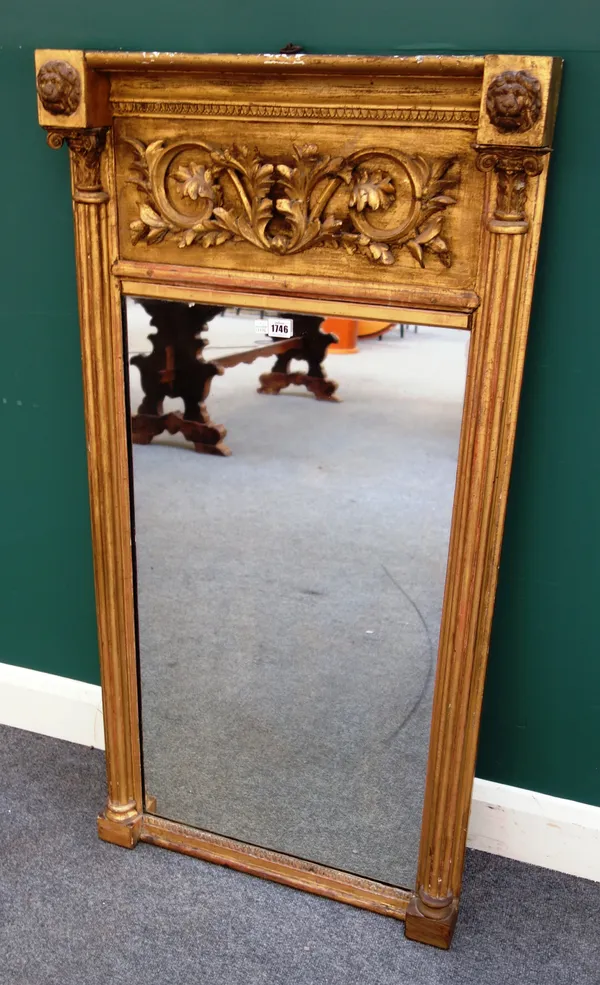An early 19th century gilt framed pier glass, with acanthus scroll frieze and fluted columns, 62cm wide x 124cm high.
